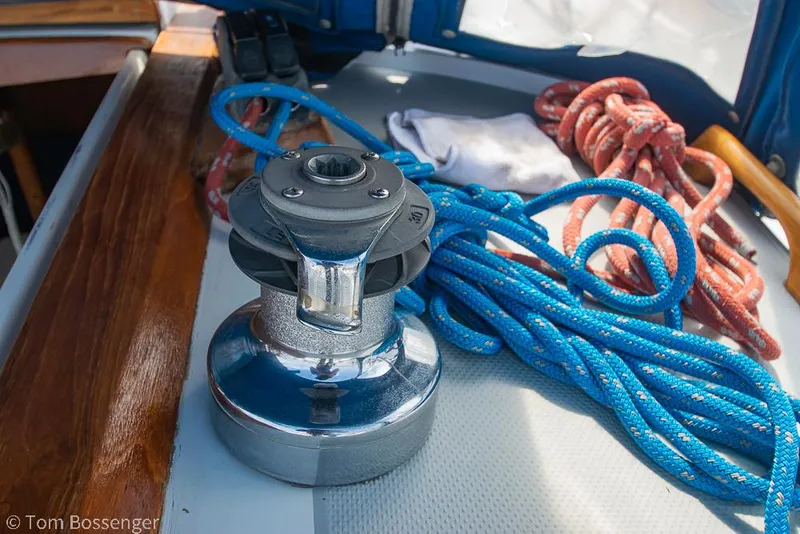 Slide: The Image of Winch and ropes on 1988 Catalina 36 sailboat deck, featuring blue and red lines. - 41