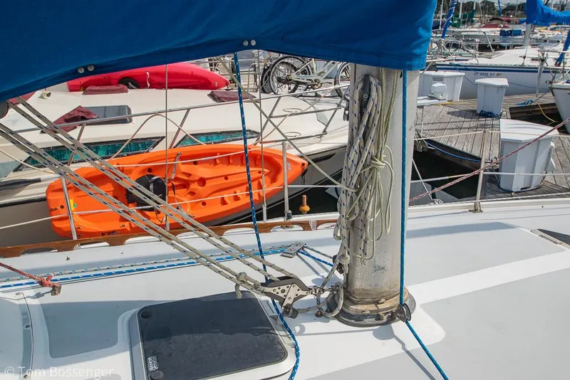Slide: The Image of Sailboat deck of 1988 Catalina 36 with rigging and docked boats in background. - 44