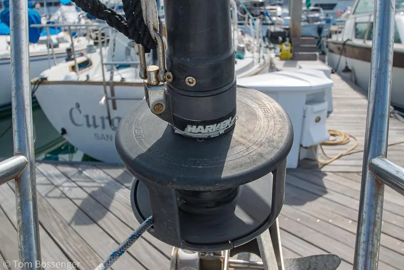 Slide: The Image of Close-up of a 1988 Catalina 36 sailboat's furling system at a marina dock. - 45