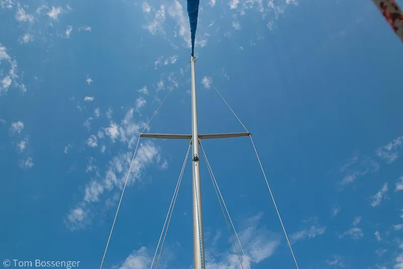 Slide: The Image of Mast of 1988 Catalina 36 sailboat against a clear blue sky. - 48