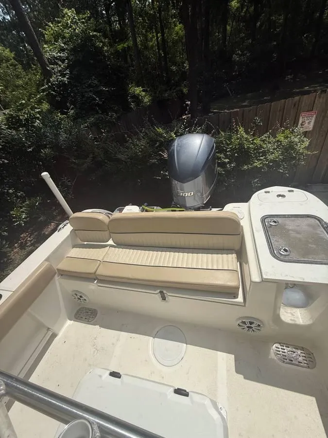 Slide: The Image of 2018 Sea Fox 248 Commander boat interior with seating and outboard motor. - 11