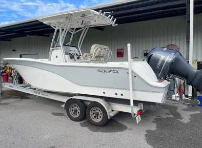 Slide: The Image of 2018 Sea Fox 248 Commander boat on trailer, parked outdoors. - 3