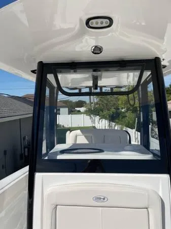 Slide: The Image of 2023 Sea Hunt Ultra 265 SE boat with sleek design and modern features. - 6