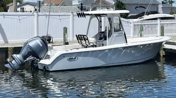 The Image of 2023 Sea Hunt Ultra 234 boat docked with Yamaha outboard motor. - 1