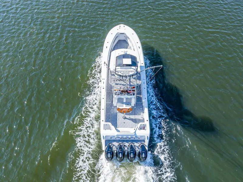 Slide: The Image of Aerial view of 2023 Front Runner 39 Center Console boat cruising on water. - 11
