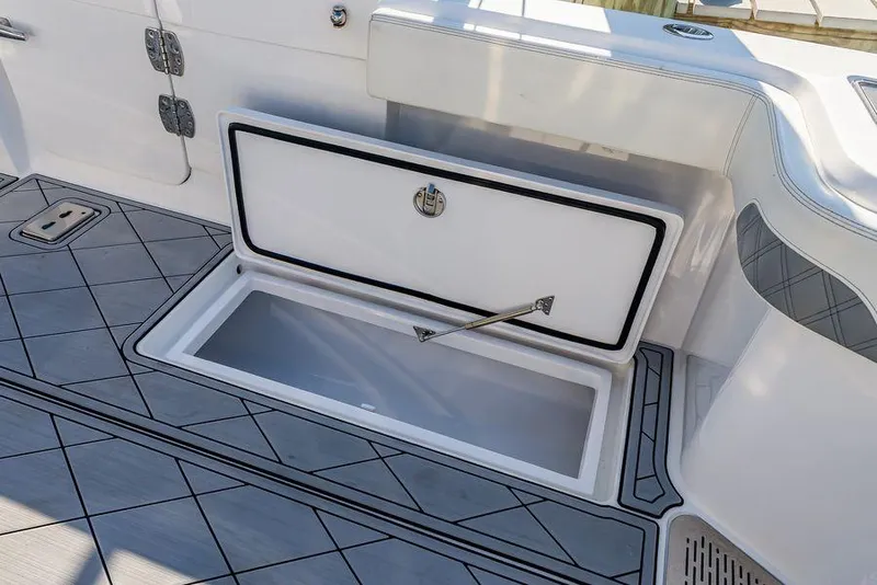 Slide: The Image of 2023 Front Runner 39 Center Console boat with open storage compartment on deck. - 16