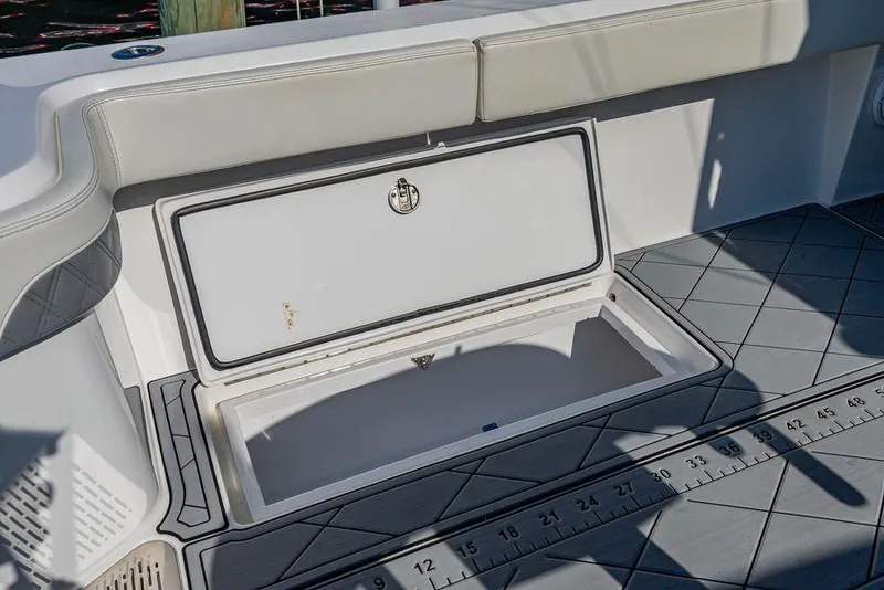 Slide: The Image of Open storage compartment on 2023 Front Runner 39 Center Console boat. - 17