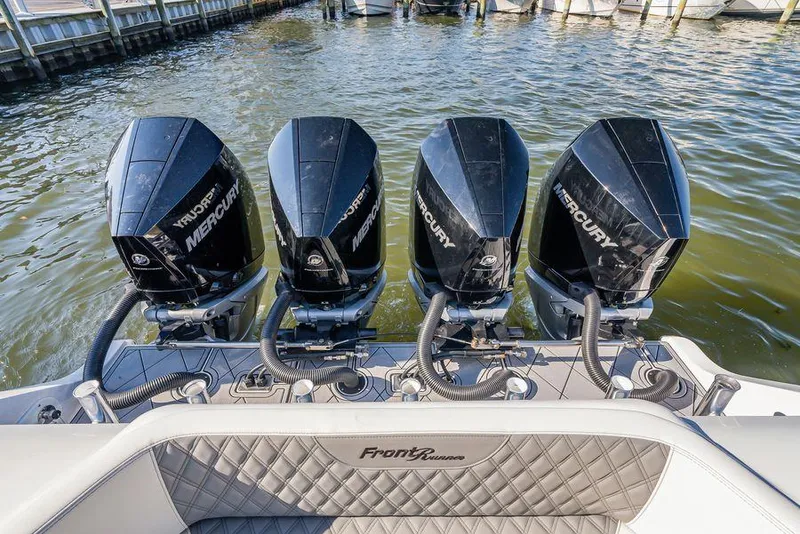 Slide: The Image of Four Mercury outboard engines on a 2023 Front Runner 39 Center Console boat. - 18