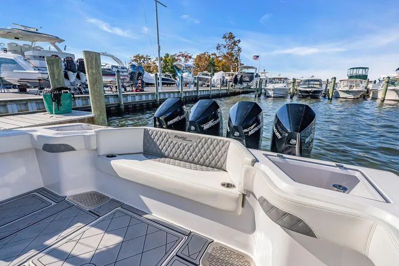 Slide: The Image of 2023 Front Runner 39 Center Console boat docked with powerful Mercury engines. - 20