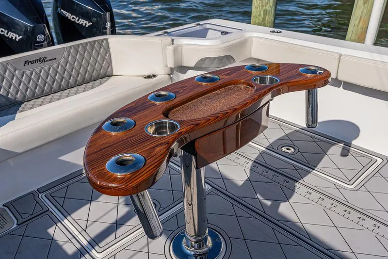 Slide: The Image of 2023 Front Runner 39 Center Console boat with elegant wooden rod holder and cup holders. - 22