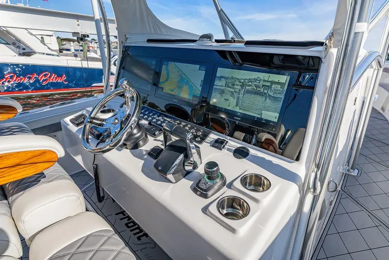 Slide: The Image of 2023 Front Runner 39 Center Console helm with advanced navigation displays and controls. - 33