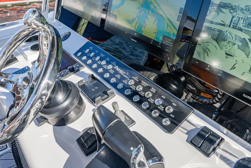 Slide: The Image of 2023 Front Runner 39 Center Console helm with advanced navigation displays and controls. - 35