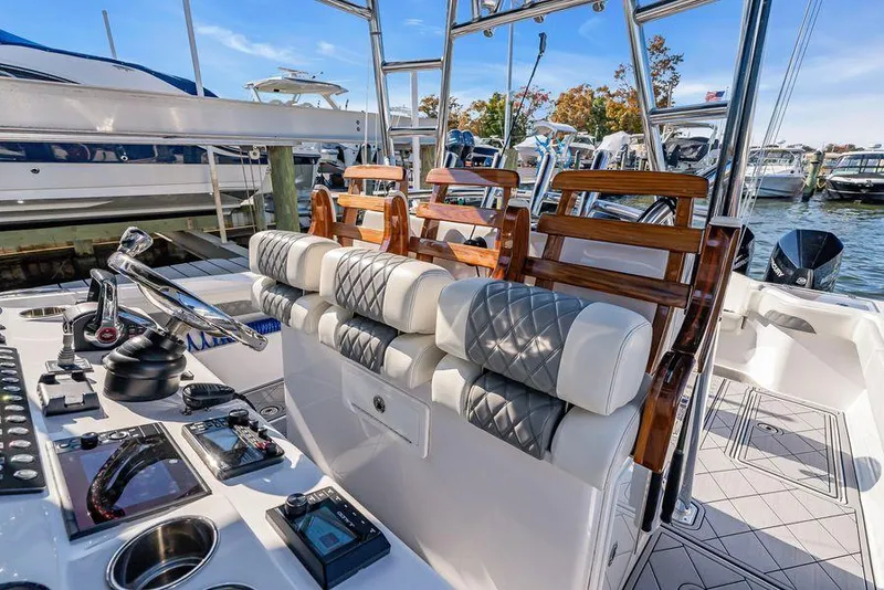 Slide: The Image of 2023 Front Runner 39 Center Console boat interior with luxurious seating and advanced controls. - 38