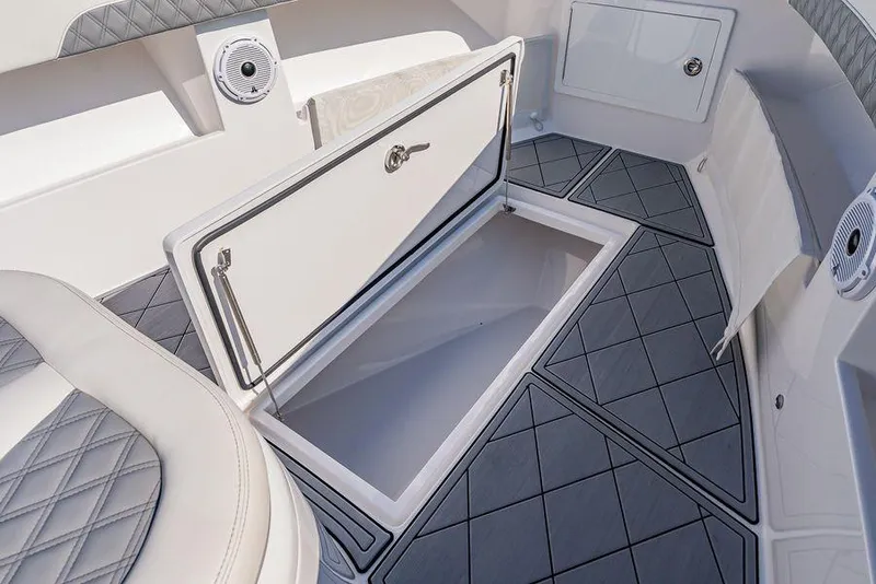 Slide: The Image of 2023 Front Runner 39 Center Console boat interior with open storage compartment and cushioned seating. - 46