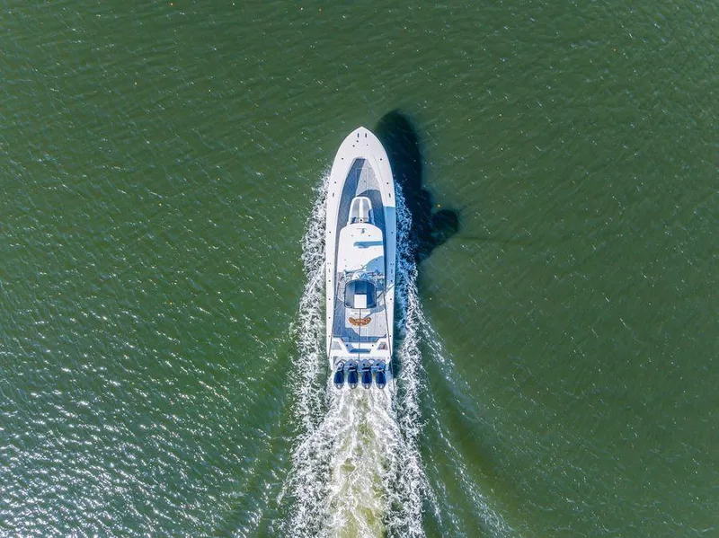 Slide: The Image of Aerial view of 2023 Front Runner 39 Center Console boat cruising on open water. - 9