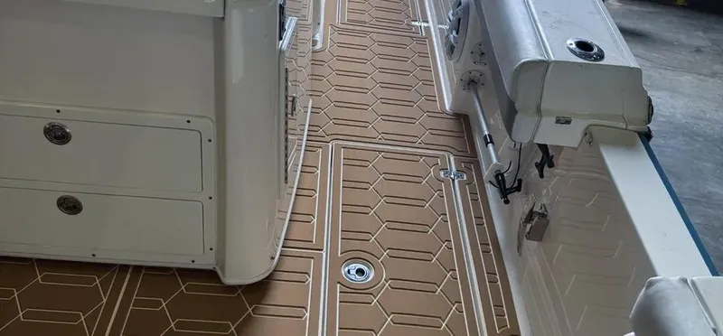 Slide: The Image of 2018 Cobia 344 Center Console boat interior with hexagonal patterned flooring. - 6