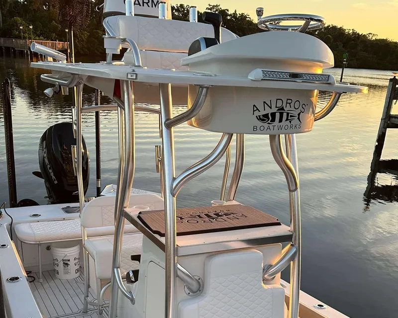 Slide: The Image of 2007 Andros Tarpon 26 boat with elevated seating, docked at sunset. - 18