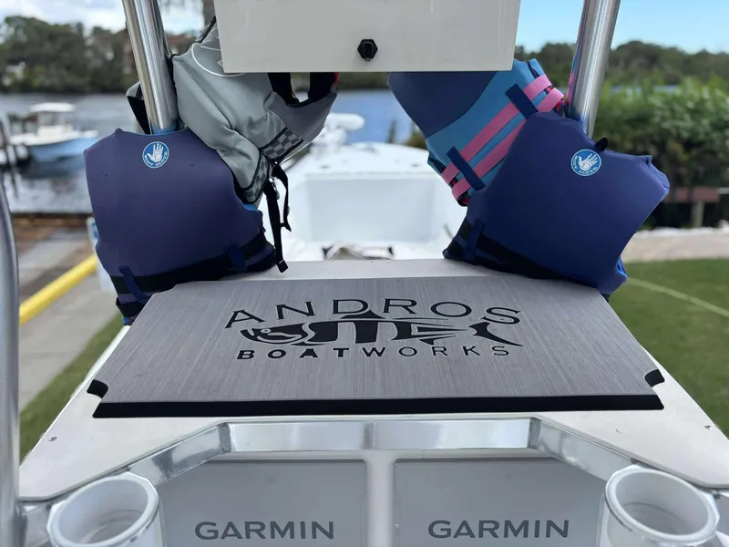 Slide: The Image of 2007 Andros Tarpon 26 boat deck with life jackets and Garmin equipment. - 19