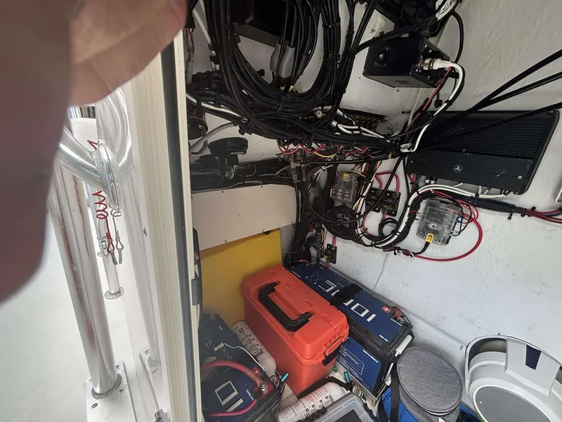 Slide: The Image of Electrical wiring and equipment inside a 2007 Andros Tarpon 26 boat. - 21