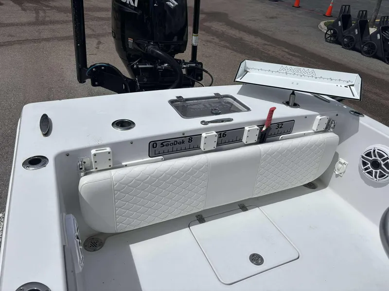 Slide: The Image of 2007 Andros Tarpon 26 boat interior with seating, measuring tools, and motor. - 23