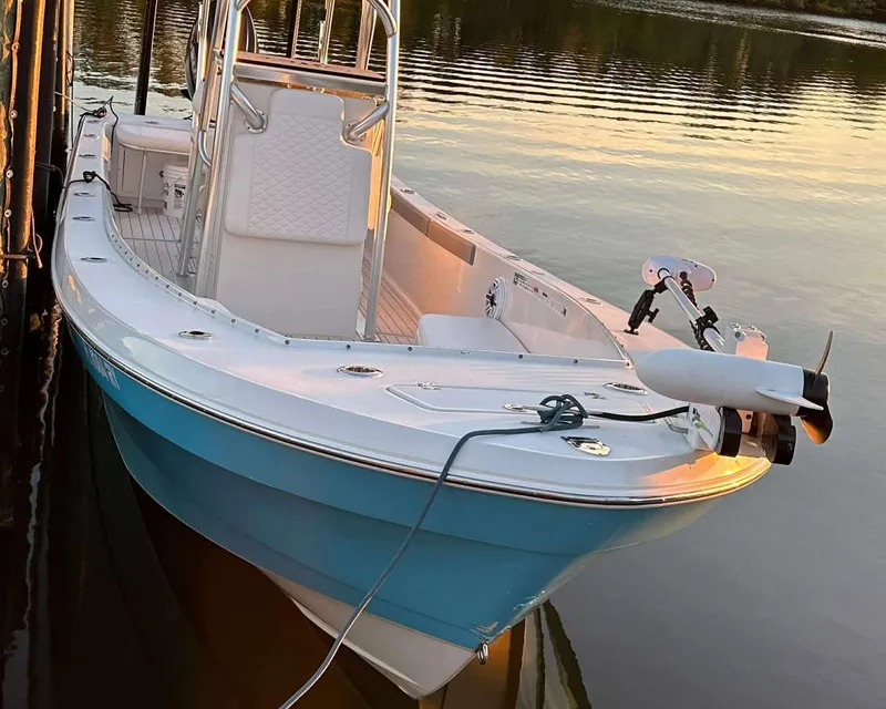 Slide: The Image of 2007 Andros Tarpon 26 boat docked on calm water at sunset. - 4