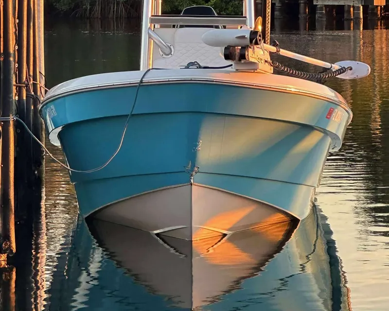 Slide: The Image of 2007 Andros Tarpon 26 boat docked on calm water at sunset. - 5