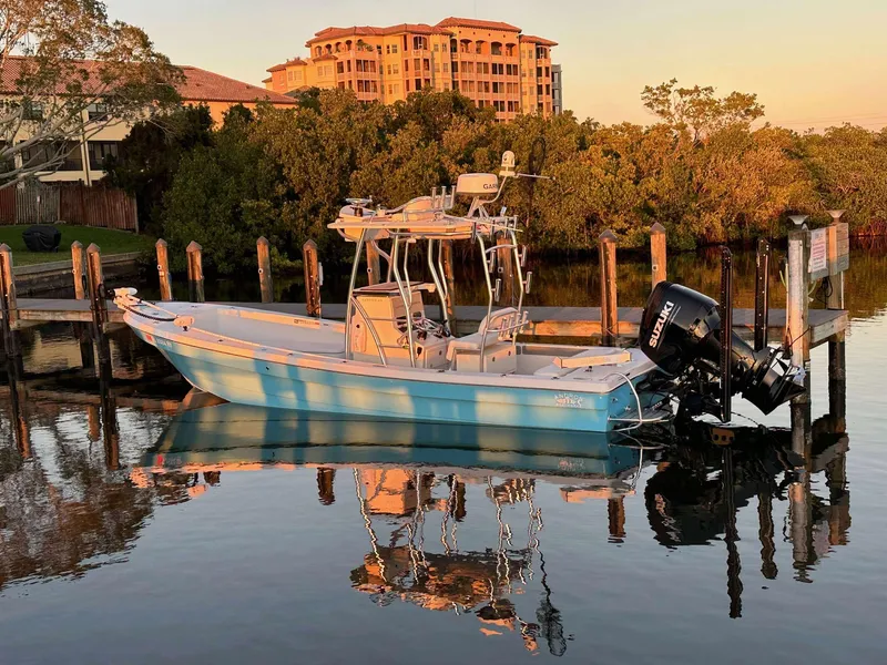 Slide: The Image of 2007 Andros Tarpon 26 boat docked on calm water at sunset. - 1