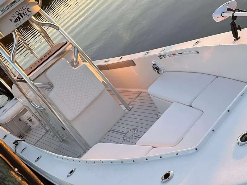 Slide: The Image of 2007 Andros Tarpon 26 boat interior with white seating and sleek design. - 12