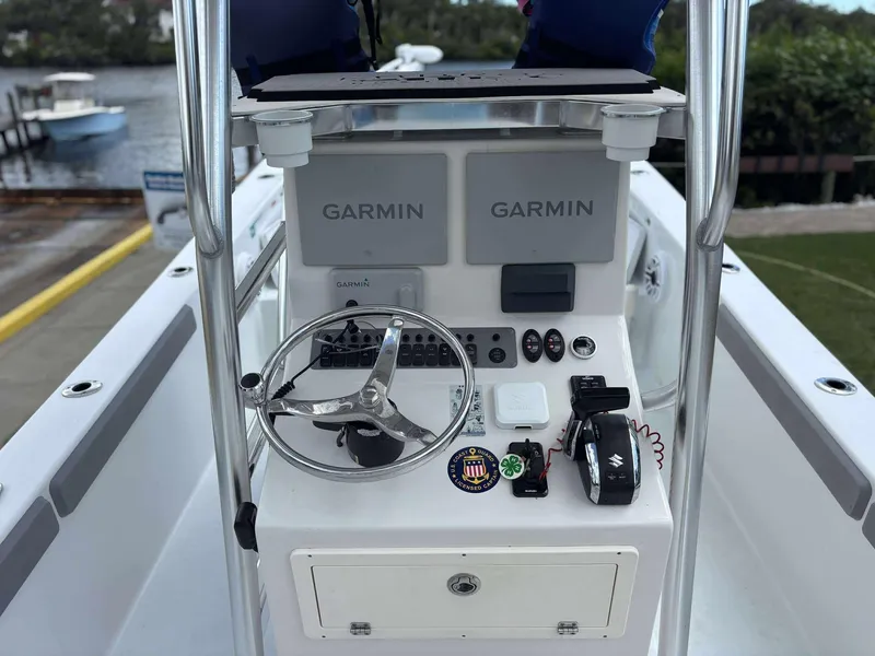 Slide: The Image of 2007 Andros Tarpon 26 boat console with Garmin navigation system and steering wheel. - 20