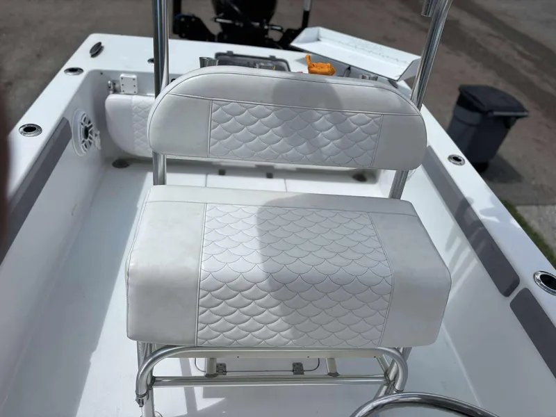 Slide: The Image of 2007 Andros Tarpon 26 boat with white quilted seating and stainless steel frame. - 22