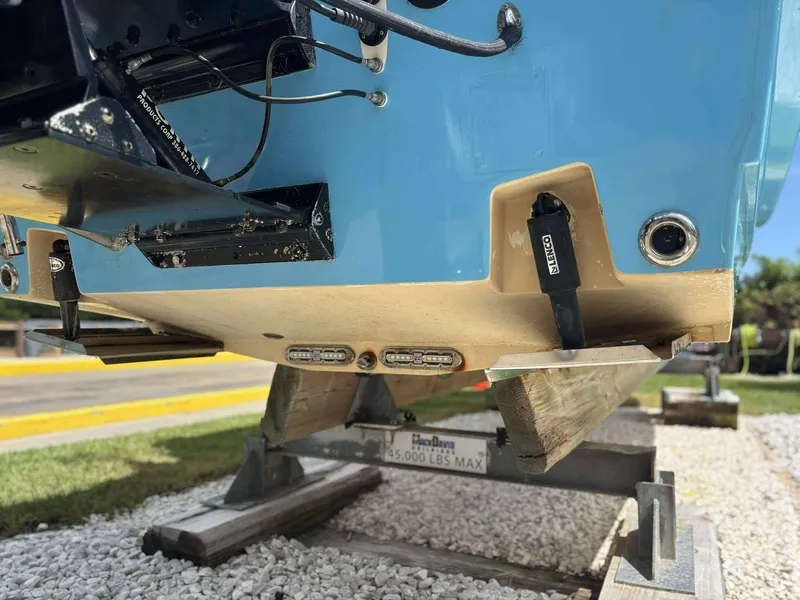 Slide: The Image of 2007 Andros Tarpon 26 boat on trailer, showing hull and trim tabs. - 24