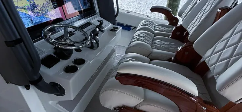 Slide: The Image of Luxurious interior of 2019 Freeman 42 LR boat with leather seats and navigation system. - 12