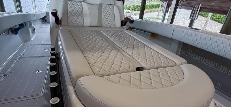 Slide: The Image of Luxurious interior of a 2019 Freeman 42 LR boat with quilted seating. - 20