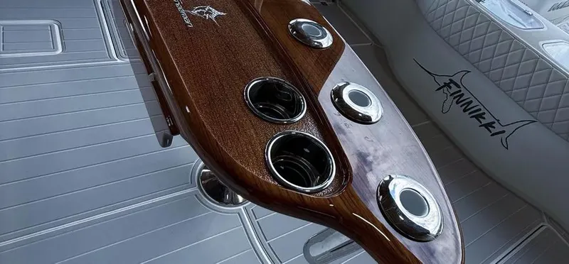 Slide: The Image of Luxurious interior of 2019 Freeman 42 LR boat with polished wood and cup holders. - 26
