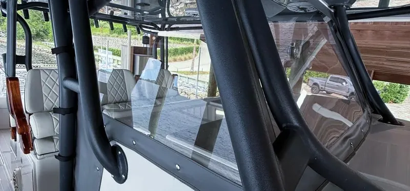Slide: The Image of 2019 Freeman 42 LR boat interior with cushioned seating and sleek design. - 5
