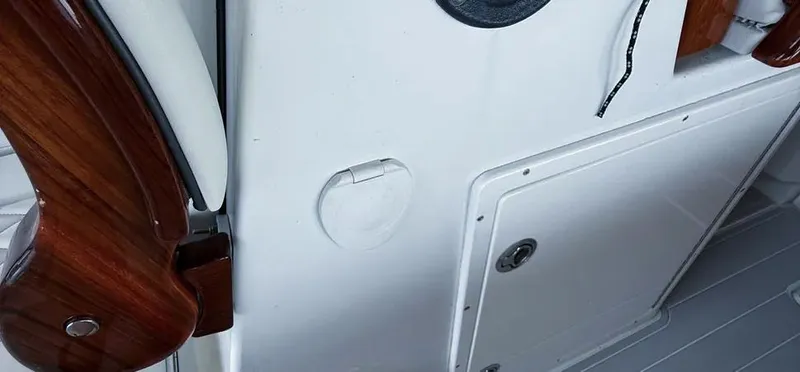 Slide: The Image of Interior detail of a 2019 Freeman 42 LR boat, featuring wood accents and storage compartments. - 7