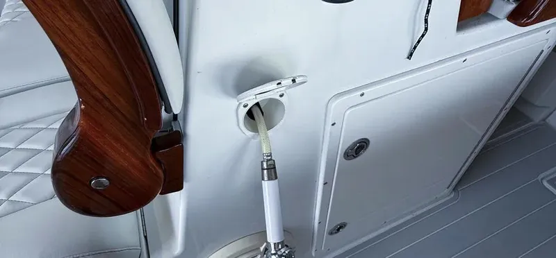 Slide: The Image of Freeman 42 LR 2019 boat interior with hose and wooden trim detail. - 8