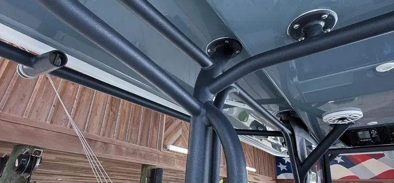 Slide: The Image of 2019 Freeman 42 LR boat canopy structure with mounted speakers and flag in background. - 9