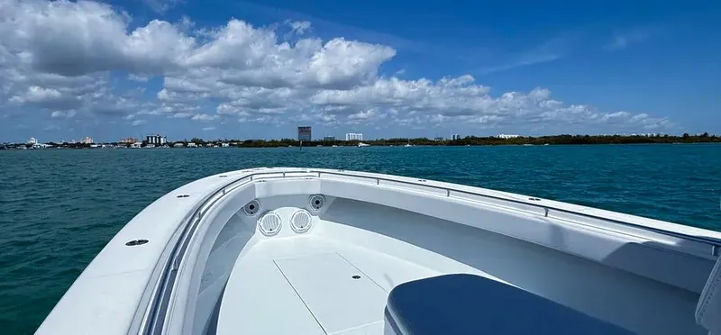 Slide: The Image of 2022 Contender 39 ST boat on blue water under a clear sky. - 18