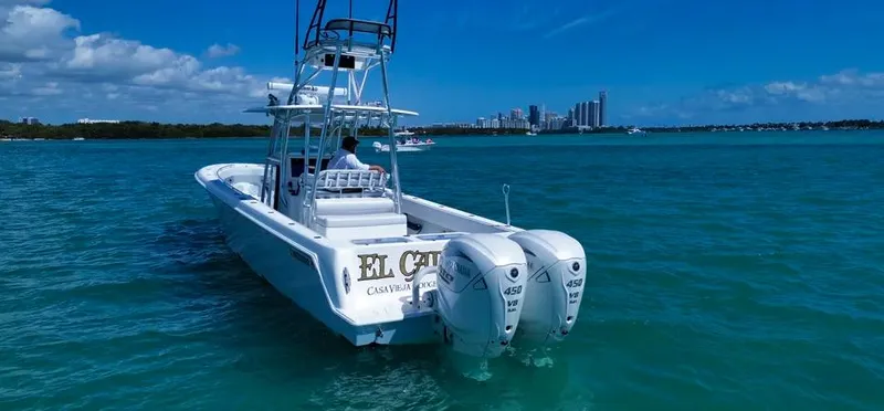 Slide: The Image of 2022 Contender 39 ST boat on blue water with city skyline in background. - 23