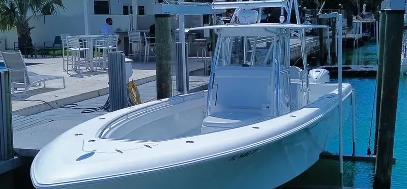 Slide: The Image of 2022 Contender 39 ST boat docked in a marina, showcasing sleek design and modern features. - 25