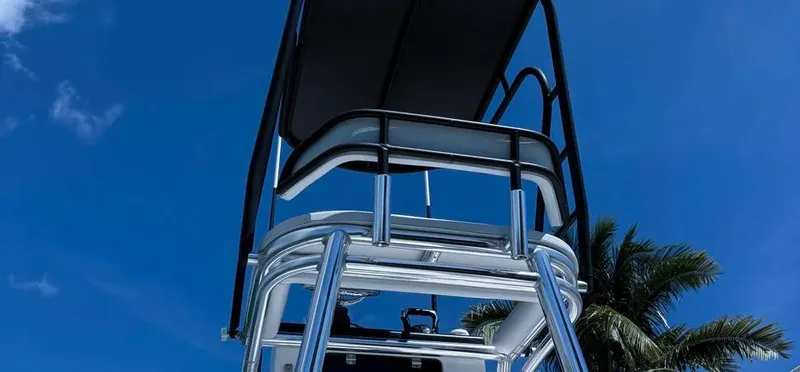 Slide: The Image of 2022 Contender 39 ST boat tower against a clear blue sky with palm trees. - 26