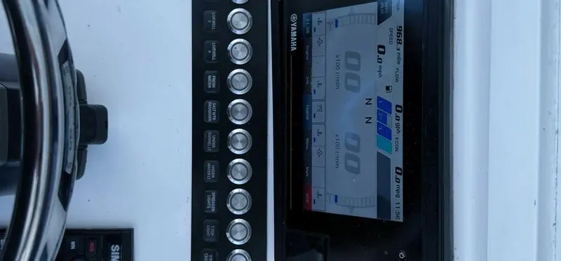 Slide: The Image of Control panel of a 2022 Contender 39 ST boat with Yamaha display. - 30