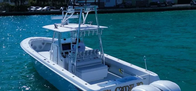 Slide: The Image of 2022 Contender 39 ST boat on clear blue water, featuring sleek design and modern equipment. - 5