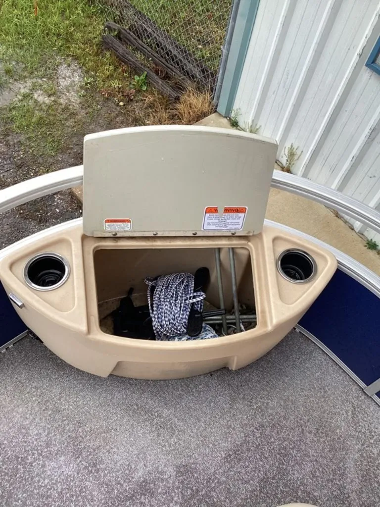 Slide: The Image of Storage compartment of a 2016 Sun Tracker 22DLX pontoon boat. - 15