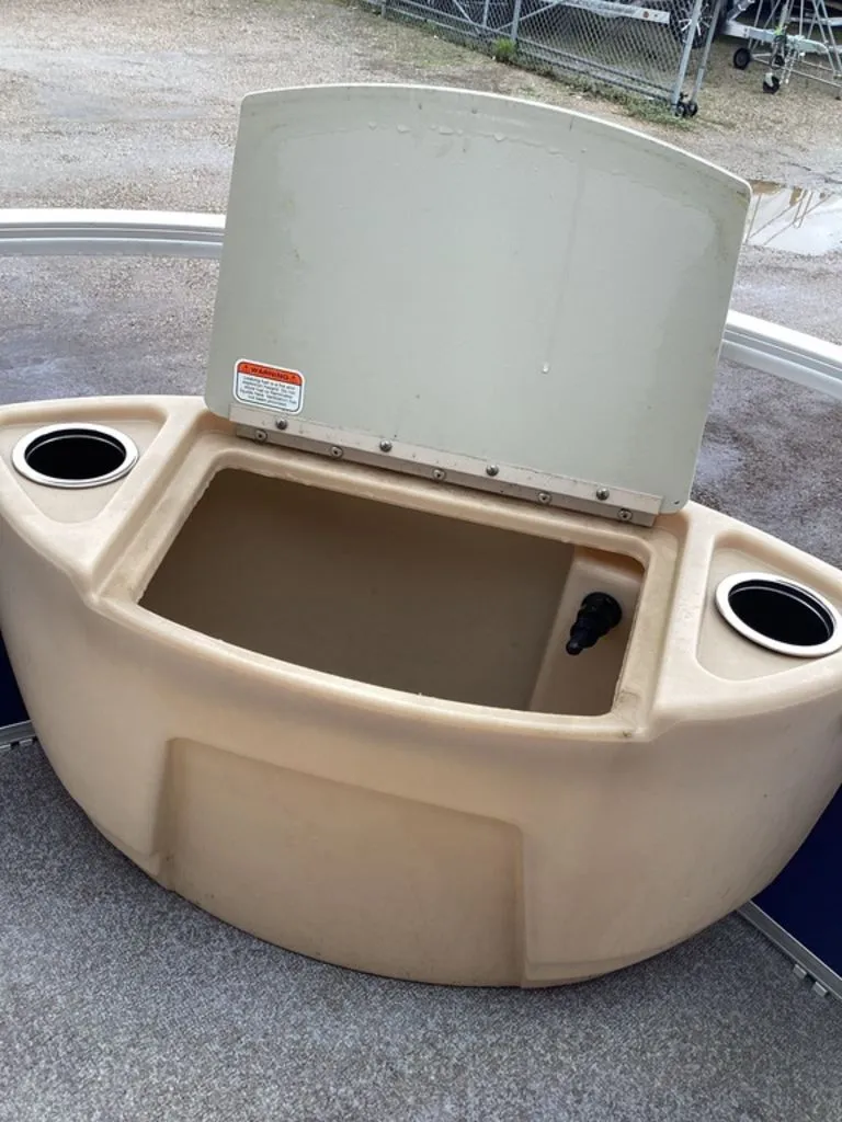 Slide: The Image of Open storage compartment on 2016 Sun Tracker 22DLX boat. - 16