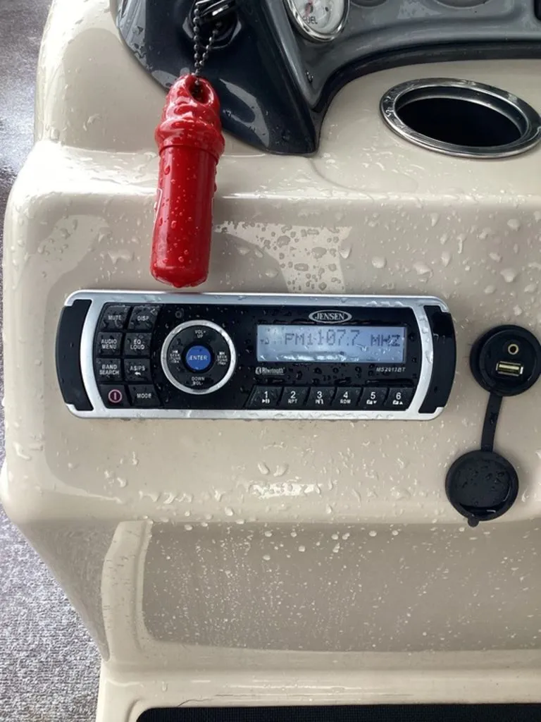 Slide: The Image of Jensen radio on Sun Tracker 22DLX 2016 boat console. - 19