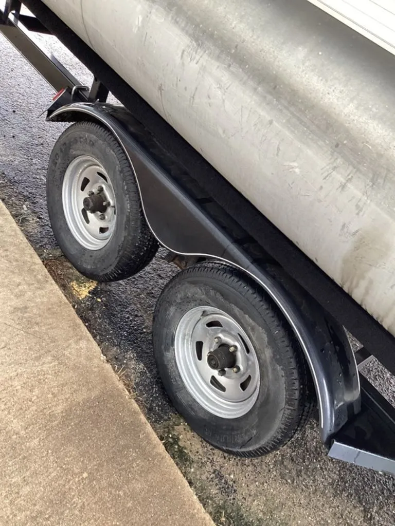 Slide: The Image of Trailer wheels of a 2016 Sun Tracker 22DLX pontoon boat. - 36
