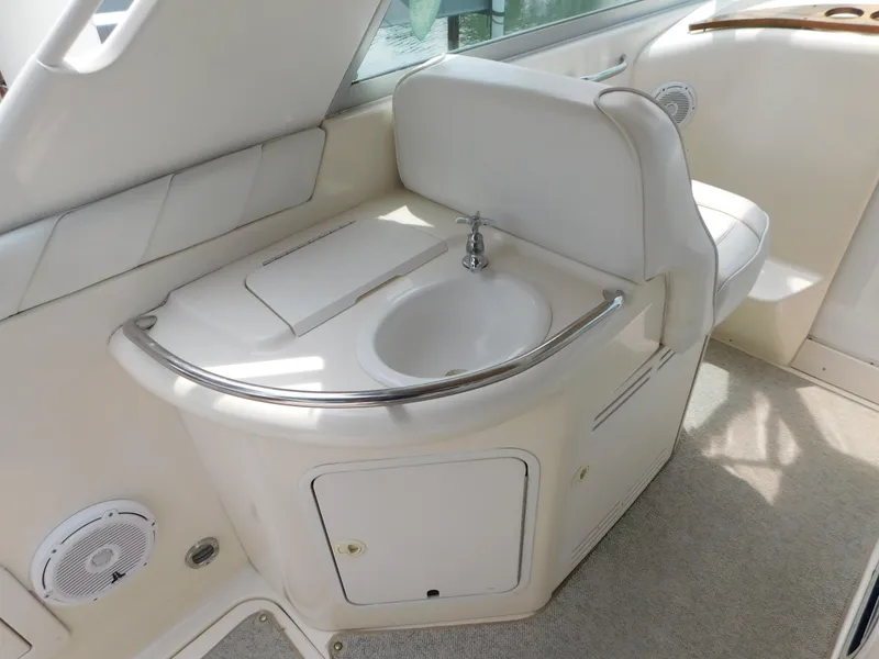 Slide: The Image of Interior of 1997 Sea Ray 330 Sundancer with sink and seating area. - 30