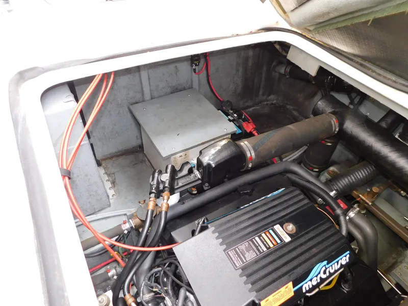 Slide: The Image of Engine compartment of a 1997 Sea Ray 330 Sundancer with MerCruiser components. - 44